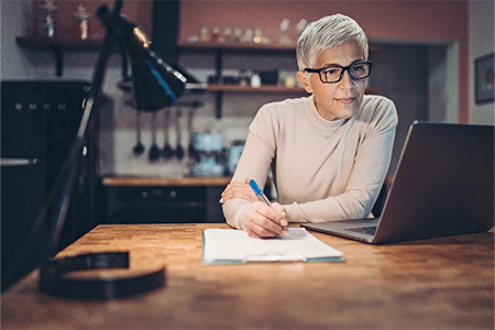 Woman working on a laptom
